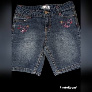 Girls jeans with embroidered hearts on front and back pockets.